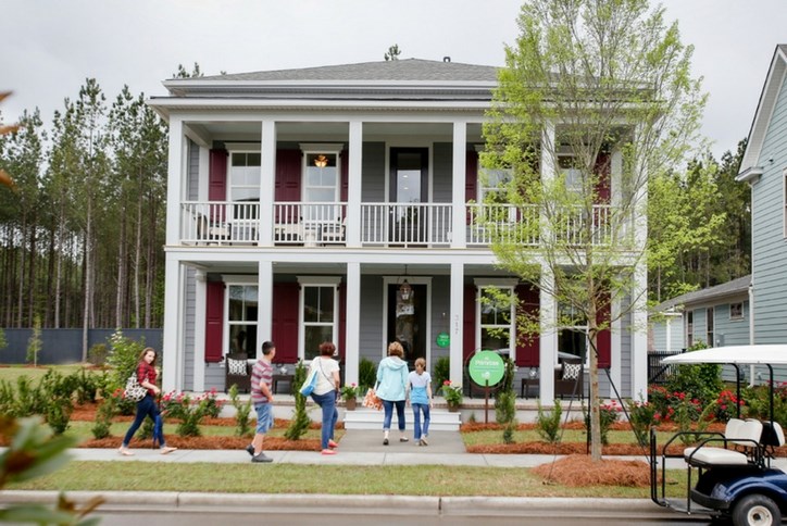 group_entering_grey_house.jpg